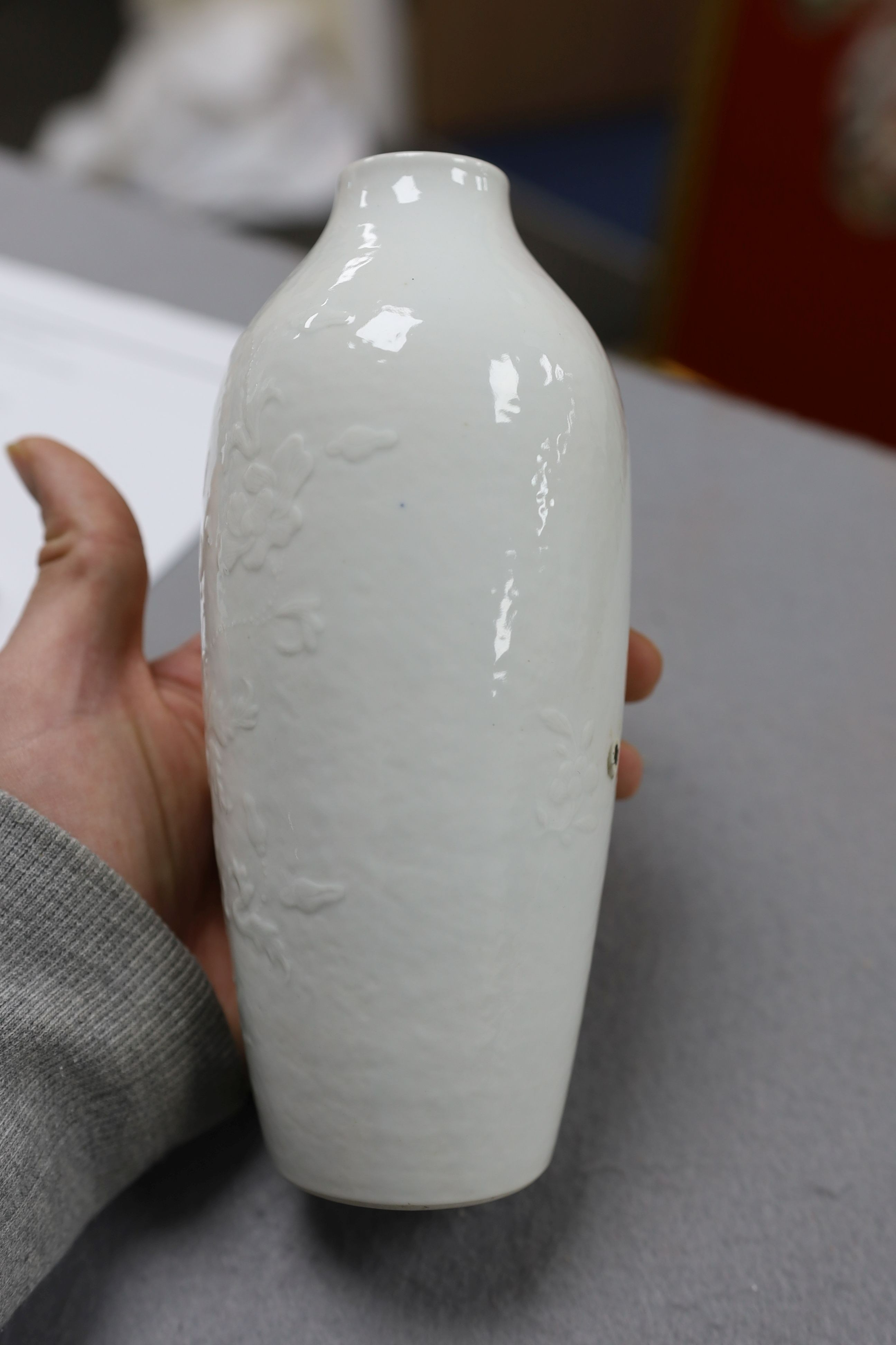 A Chinese moulded white glazed vase, Qianlong period, 18.3cm high, glaze blemish